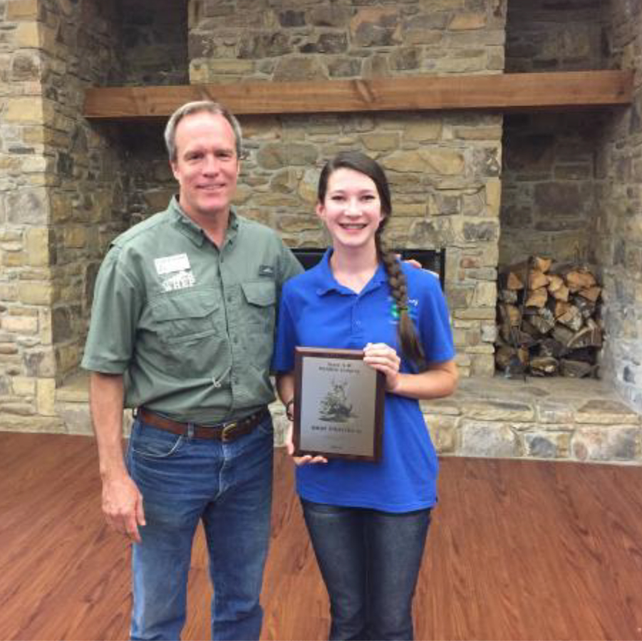 Wildlife Judging Results - Dr. Craig Harper, Extension Wildlife Specialist, with Sophie Buck of Lincoln County, the High Individual winner.