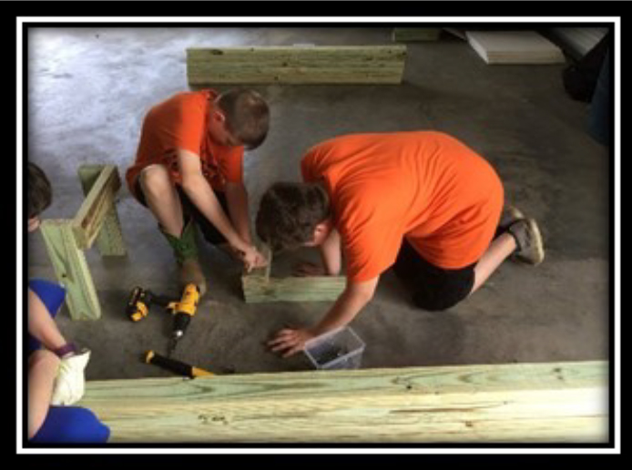 4-H Day Of Service Scott County- Boys learning wood working