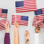6 American Flags being held high