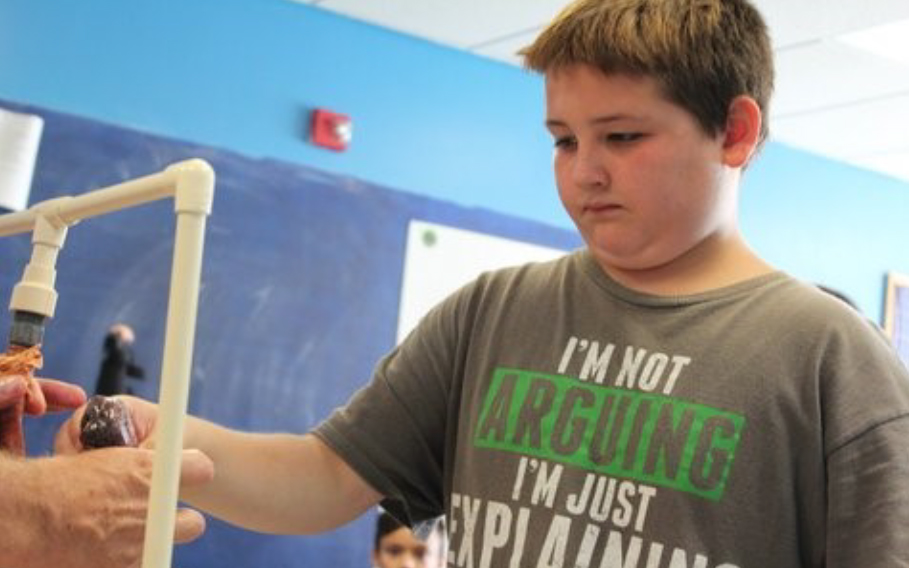 4-H Health Rocks! Produces Positive Results - 4-H'er working on his project