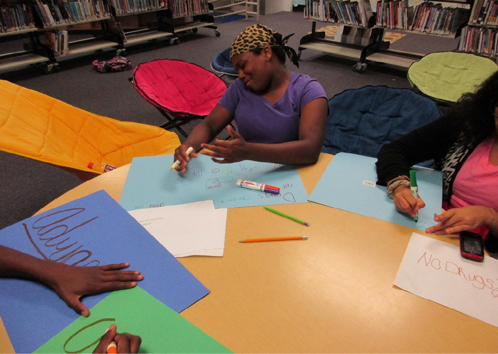 HENRY COUNTY GRADUATES YOUTH FOR HEALTHIER LIVES - 4-H girls working on posters