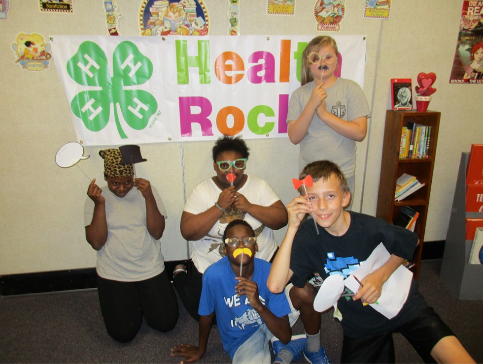 HENRY COUNTY GRADUATES YOUTH FOR HEALTHIER LIVES - 4-H kids making funny face masks from straws