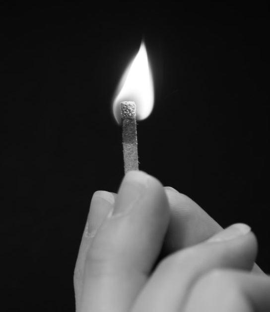 Photo Search - Hand holding a match.