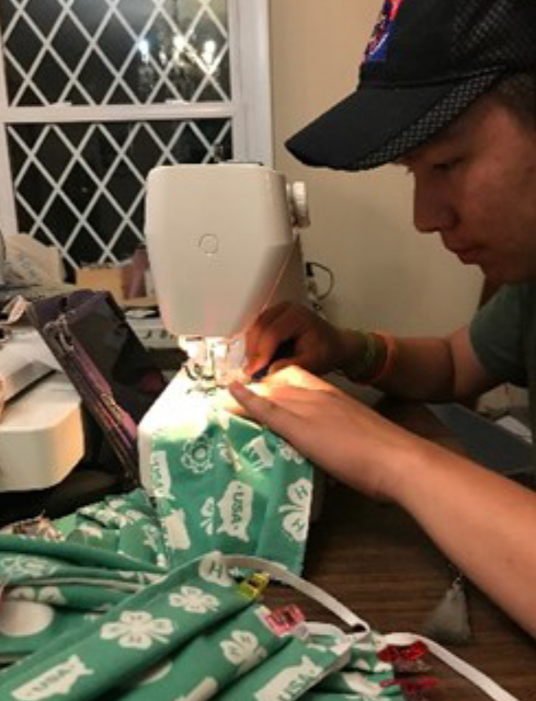 Madison County 4-H'er sewing COVID 19 masks