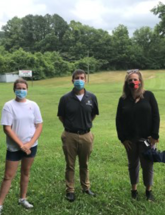 Rylee Walton, Aaron Browning, Lauren Rider at the site of the fu- ture dog park.