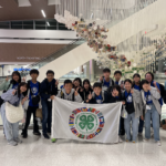 Fourteen Japanese youth with their chaperones