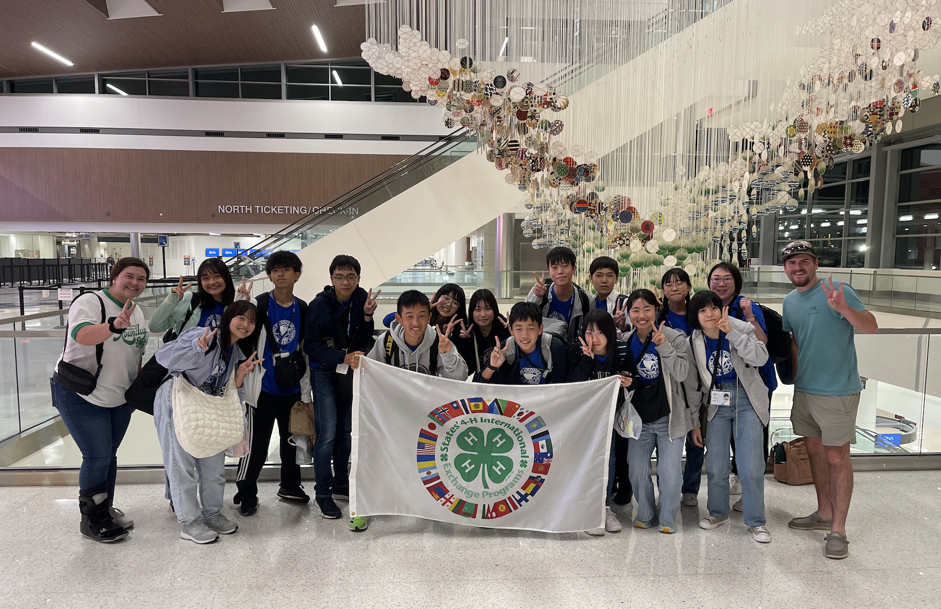 Fourteen Japanese youth with their chaperones